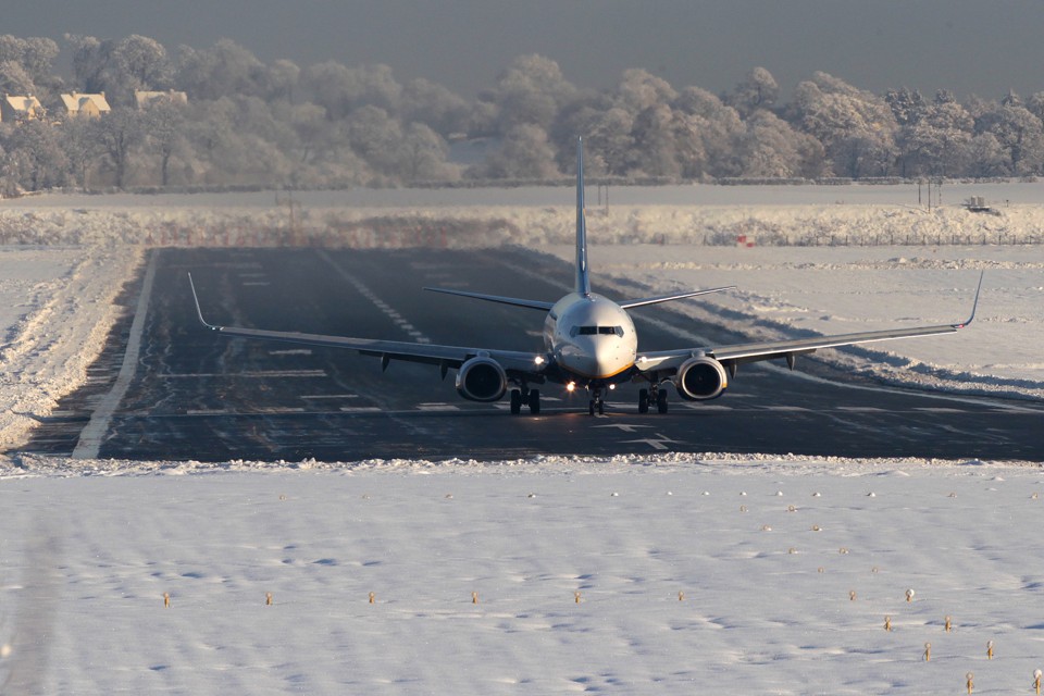 An aircraft manoeuvres on the runway at Edinburgh Airport in Scotland